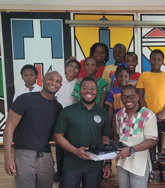 ASP delivers laptops to Guyana