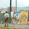 student walking past construction site