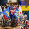 Military and United States flags sit at the reception desk that greets visitors at the Veterans Resource Center at Costo Hall. The VRC moved from Bannockburn Village to Costo Hall over the summer.  (UCR/Stan Lim)
