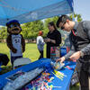 Simon Tam stops by the CHASS booth on Tuesday, April 25, 2023. (UCR/Stan Lim)