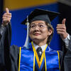 Graduate giving thumbs up