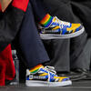 CHASS dean wearing colorful UCR-themed shoes