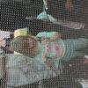 Kids examining live butterflies