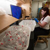 employee unpacking glassware