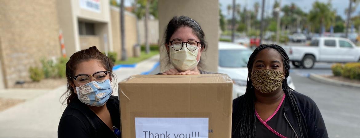 students delivering masks