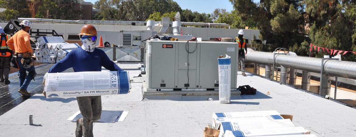 Crews working on Physics building roof