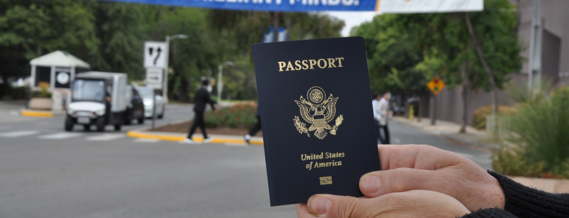 passport in front of UCR banner