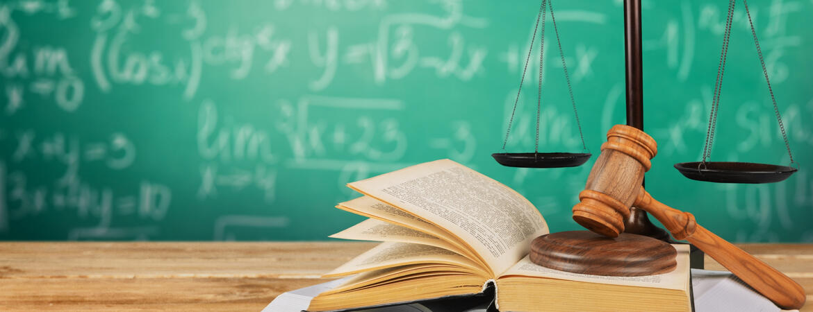 Chalkboard, gavel and law scales