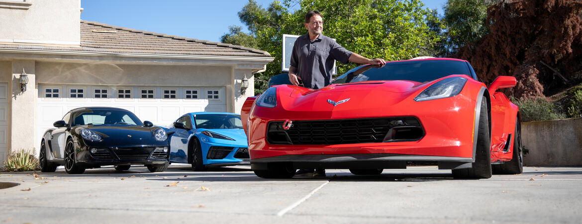 Ted Garland with his Corvettes and Porsche