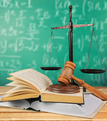Chalkboard, gavel and law scales