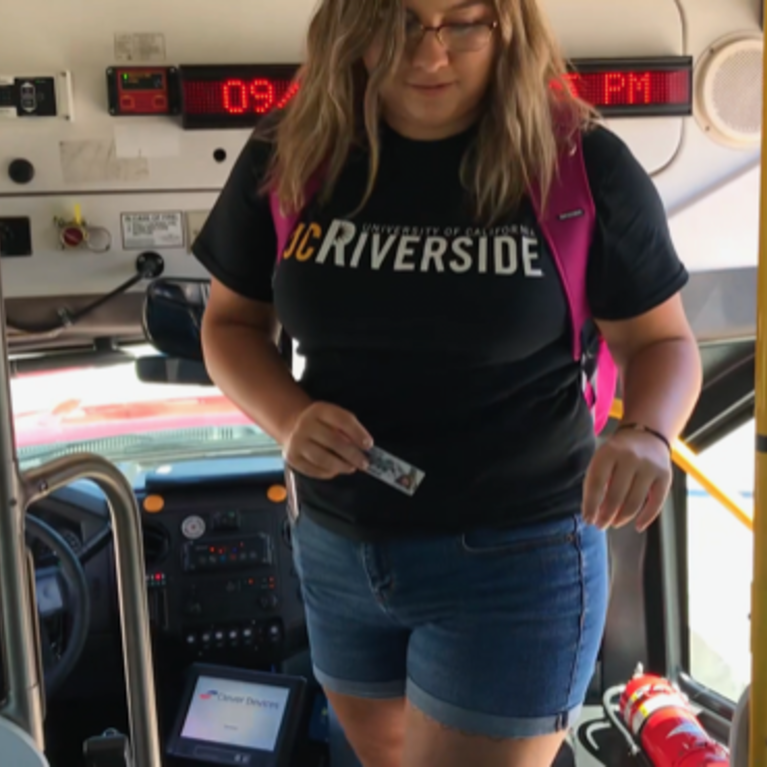 Student riding RTA bus.