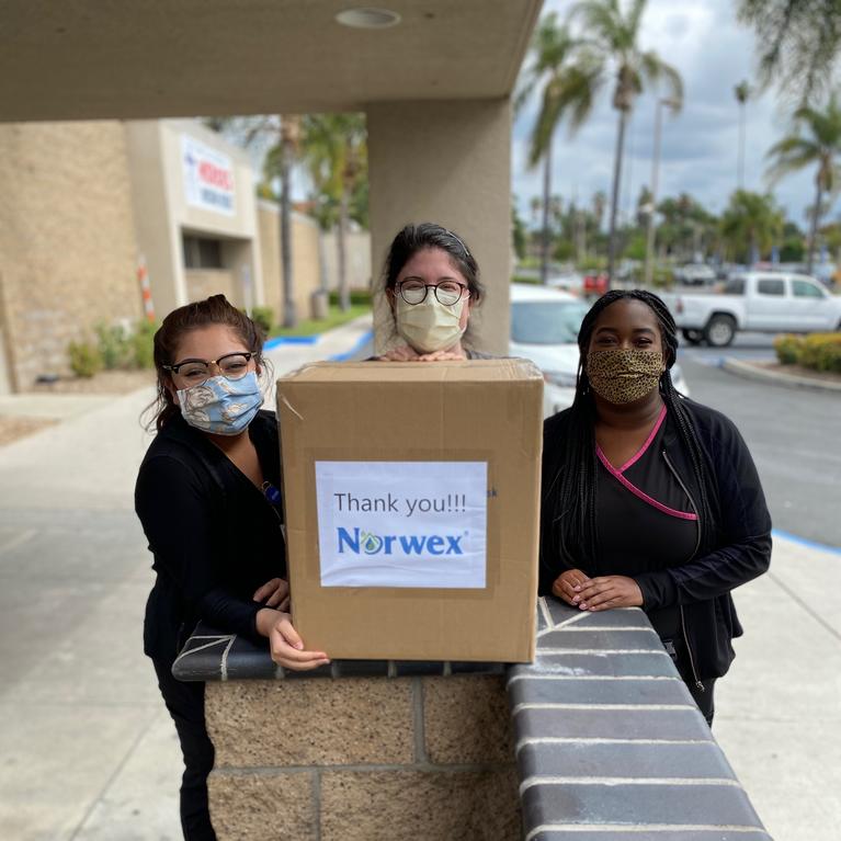 students delivering masks
