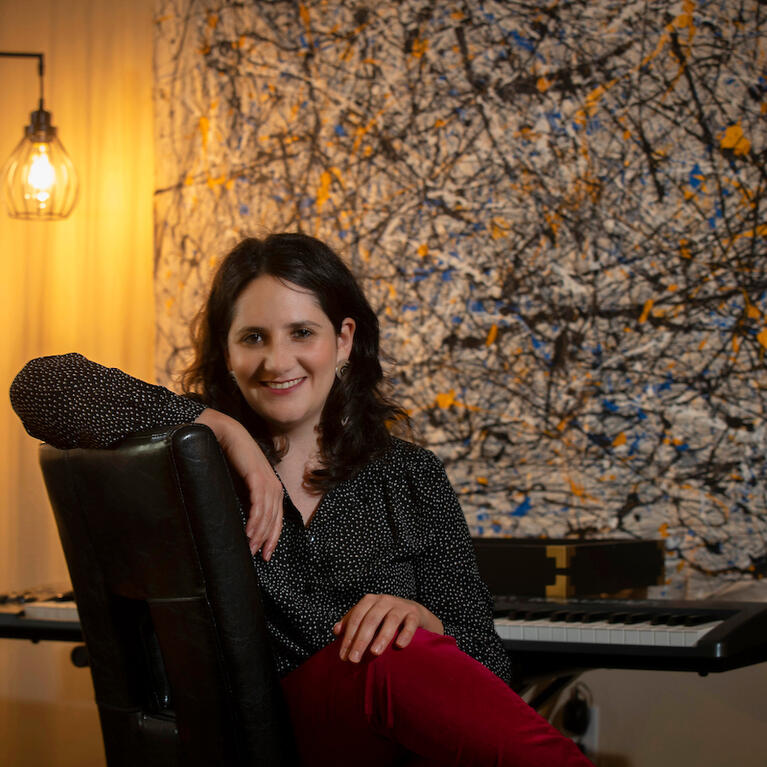 Dana E. Kaufman, assistant professor for UC Riverside’s Department of Music, in her home on March 30, 2021, in Riverside. (UCR/Stan Lim)