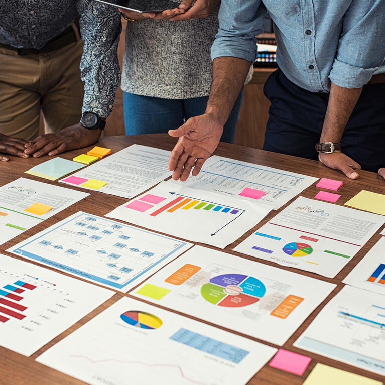 Officials examining graphs before decision making
