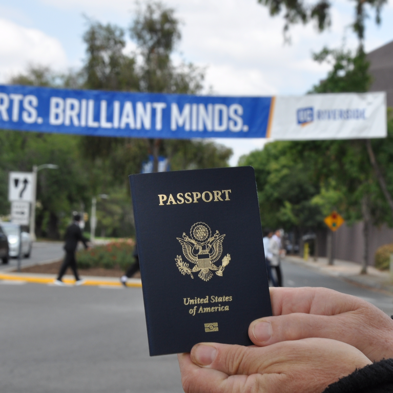 passport in front of UCR banner