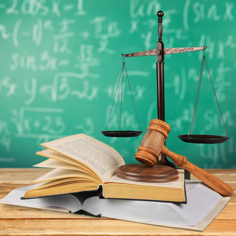 Chalkboard, gavel and law scales