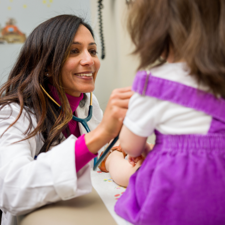 Pediatrician with patient