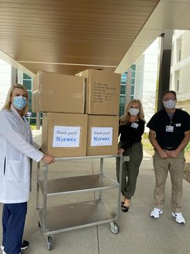 students delivering masks