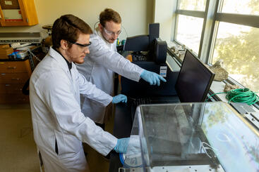 Klenner and undergraduate in the lab